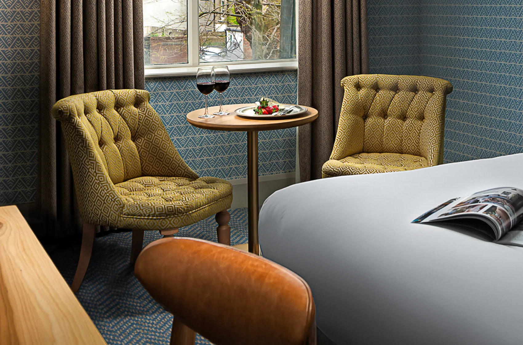 Cosy seating area inside a spacious guest room at Schoolhouse Hotel Dublin