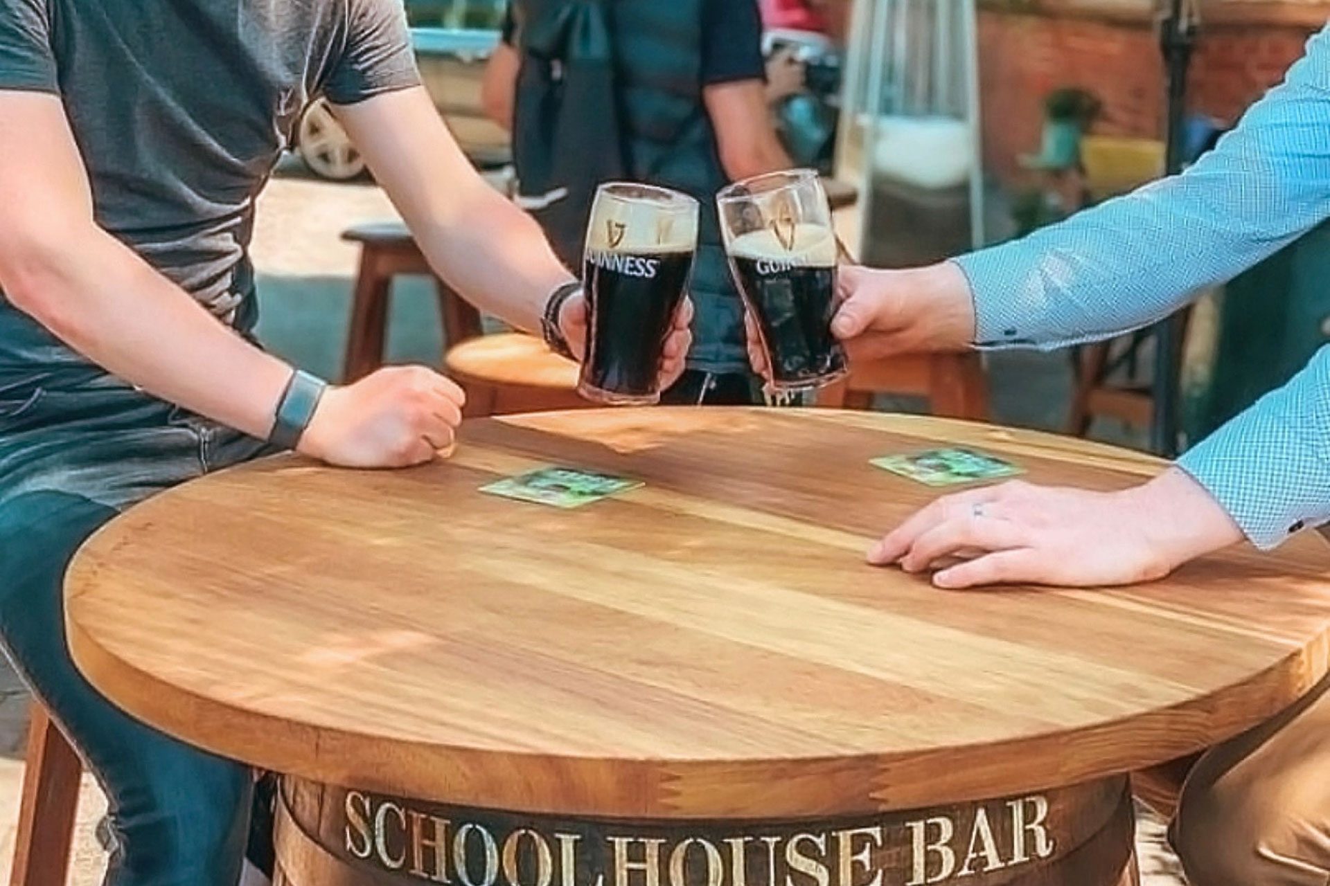 Garden-area-friends-enjoying-guinness-pints-cheers